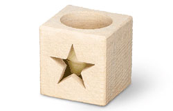 Carved limestone votive holder with star design.